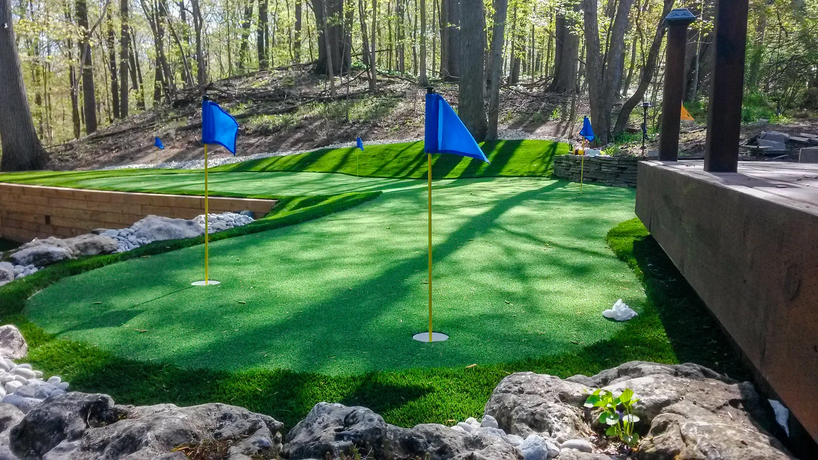 Custom putting green synthetic turf installation